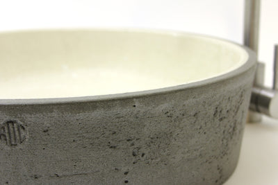 ROC Products concrete basin A striking, unique concrete basin with a mainly smooth off white interior and a textured, characterful natural grey exterior. A substantial, solid concrete basin. Approx. size - Dia. 450mm H. 130mm.