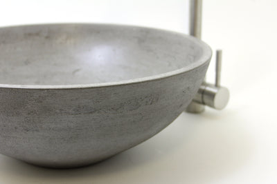 A ROC Products concrete basin A simple and elegant concrete basin in our light grey Smokestone mix with delicate details and variations inside and a sand textured outer.  Approx.  size - Dia. 410mm  H. 150mm.
