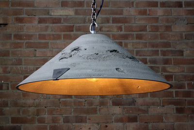 Our Lustrous Natural 3 raw surface artisan concrete pendant light showing chain hook and concrete surface detail,  the counter balance lead weight, chain and electrical cable. Also showing the ROC embossed logo on the concrete lampshade, the inside surface detail bulb and counter balance weight